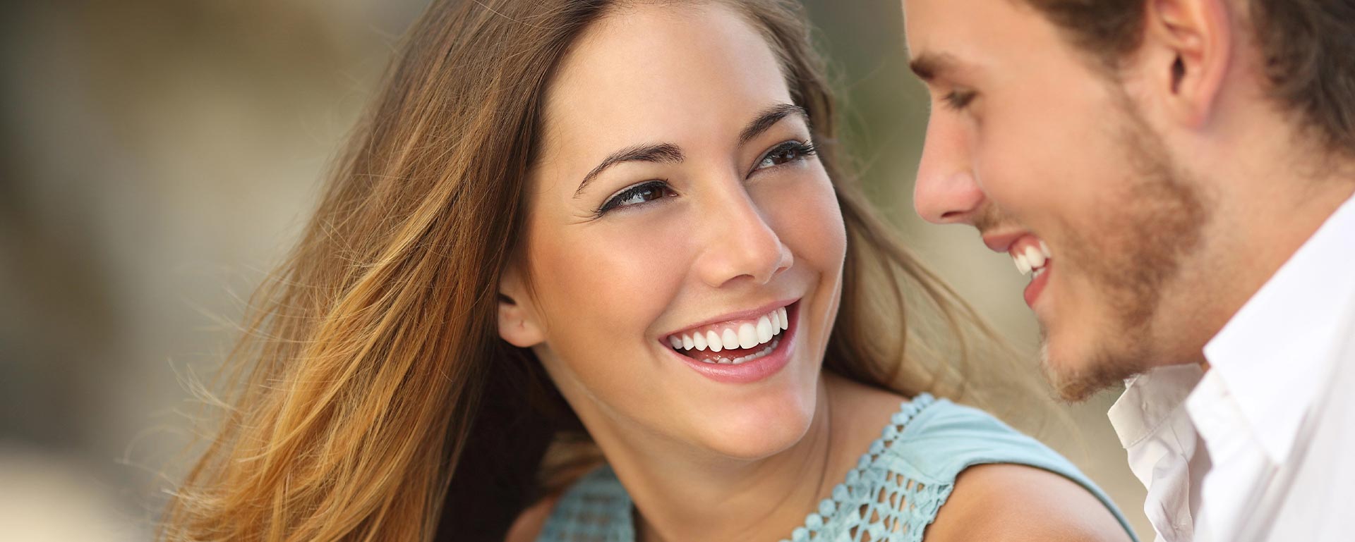Couple laughing with a white perfect smile